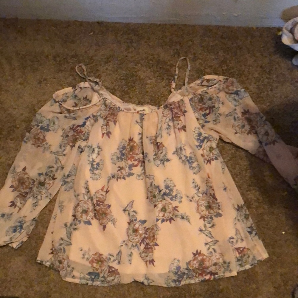A cute off the shoulder shirt with sleeves
